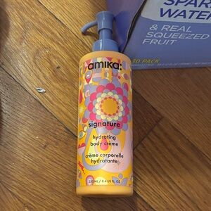 Amika Signature Hydrating Body Creme - Vibrant Orange and Purple. Never used!